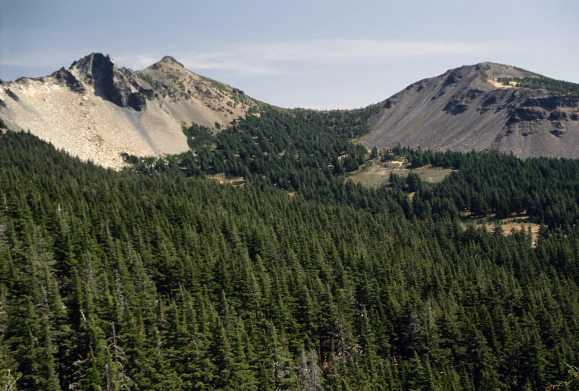 Mount Thielsen and a neighboring peak above a forested valley